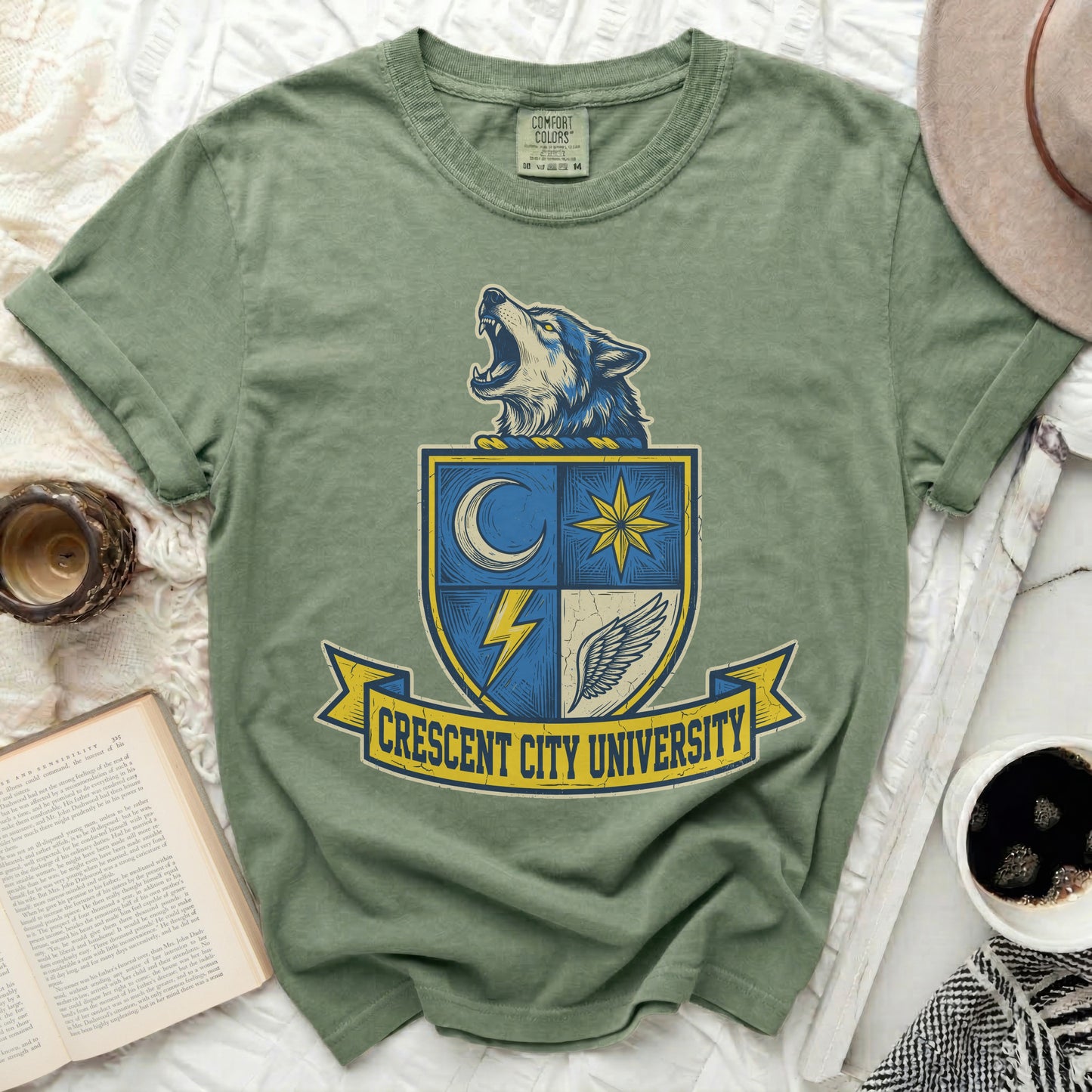 Green t-shirt with a wolf crest for Crescent City University.