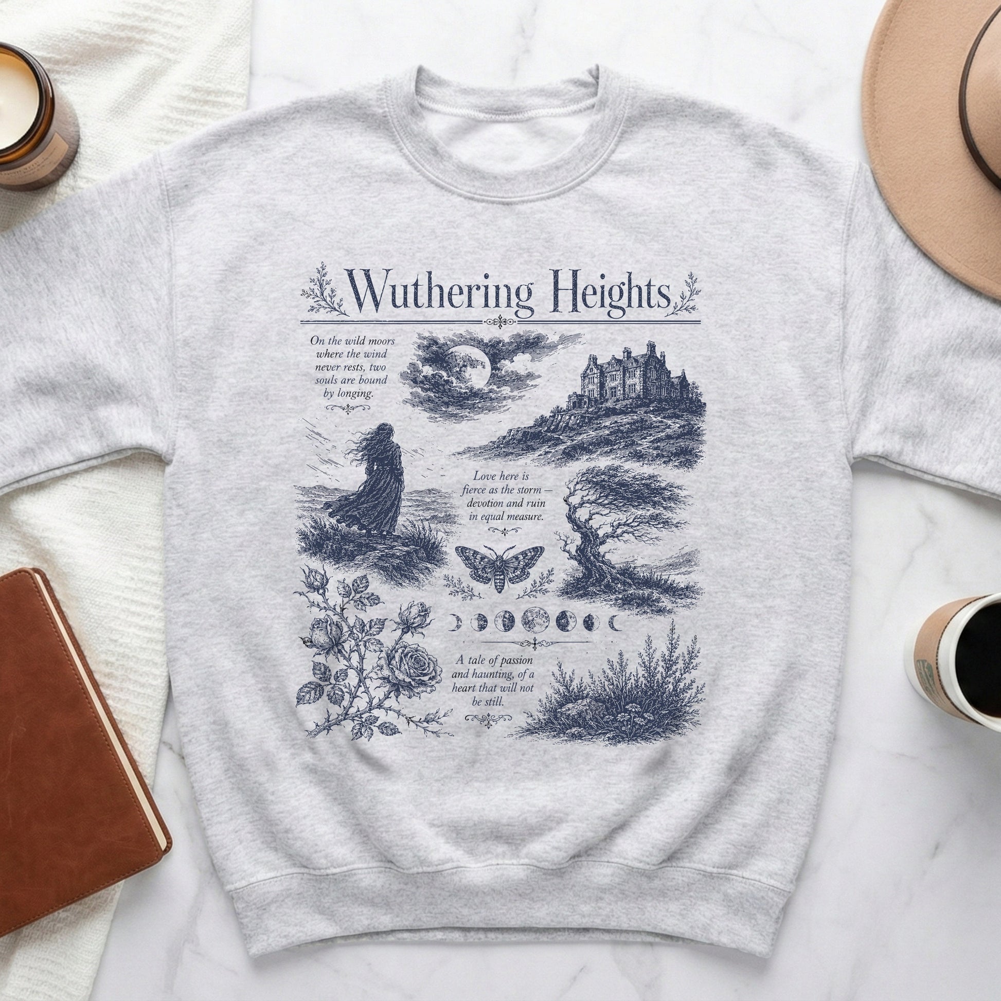 Light grey sweatshirt with "Wuthering Heights" text and dark blue literary illustrations.