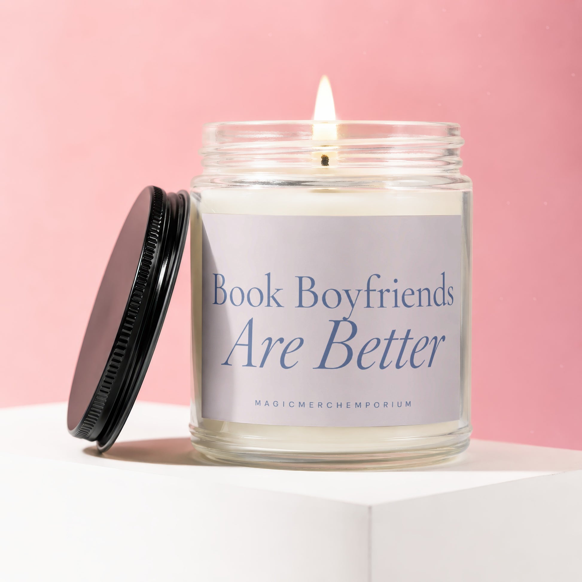 Glass candle with lit wick, label reads "Book Boyfriends Are Better".