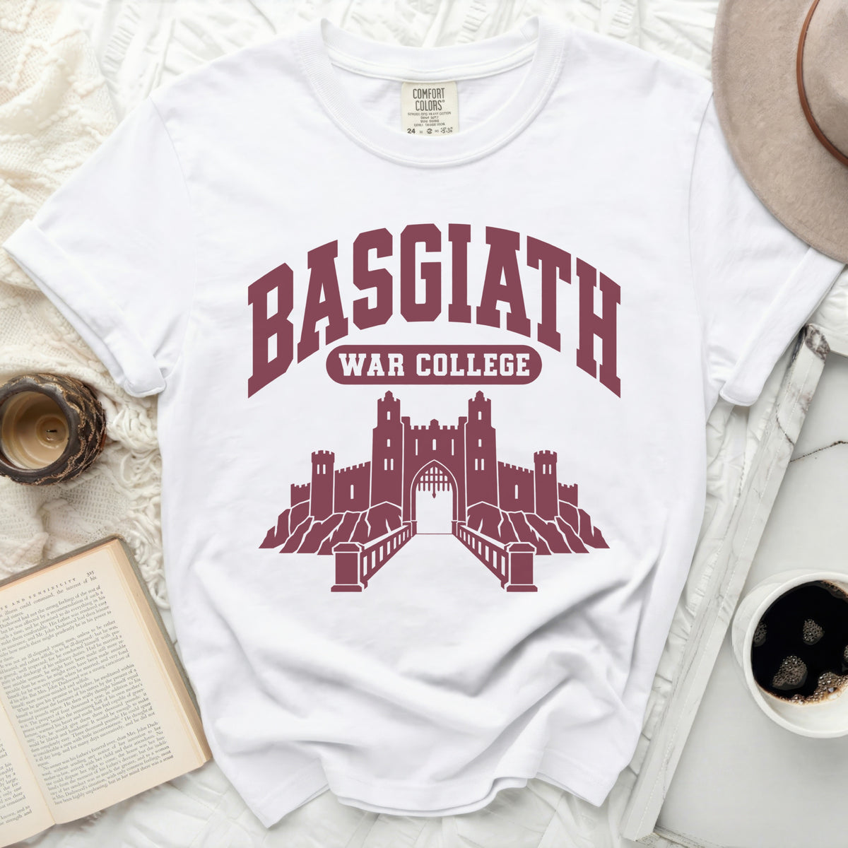 White t-shirt with maroon "BASGIATH WAR COLLEGE" text and castle graphic.