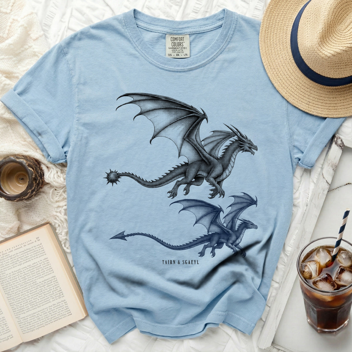 Light blue t-shirt with two charcoal dragons and "Tairn & Sgaeyl" text.