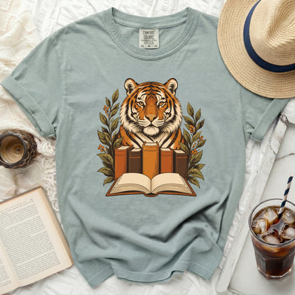 Tiger with open book and surrounding foliage design on a t-shirt.