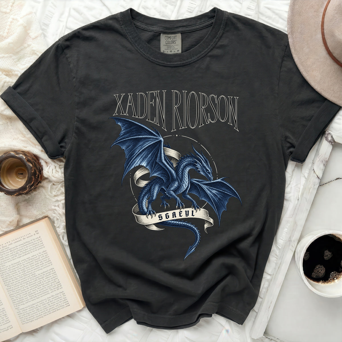 Dark t-shirt with a blue dragon graphic and text "XADEN RIORSOM SGAEYL".