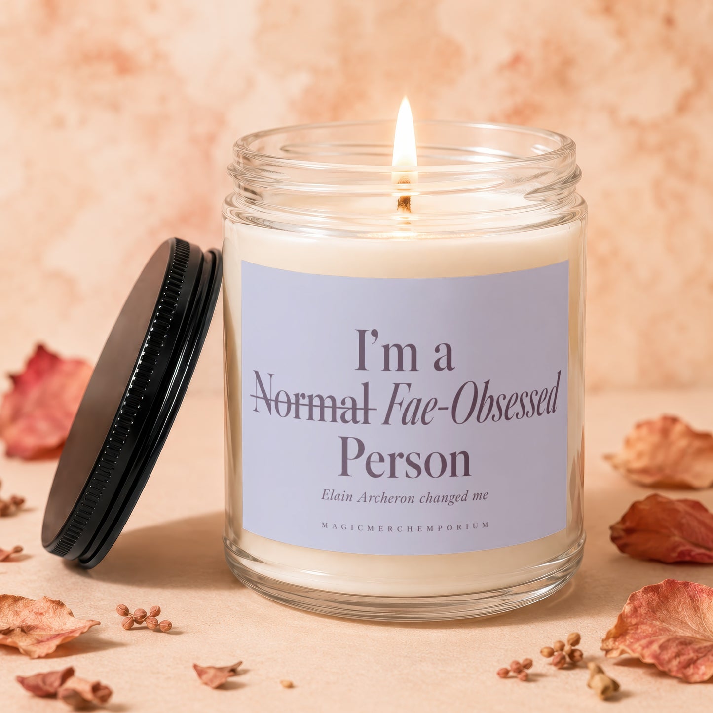 Lit candle in glass jar with 'I'm a Normal Fae-Obsessed Person' text.