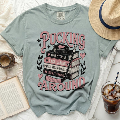 T-shirt with "Pucking Around" and book titles like "Love Stories."