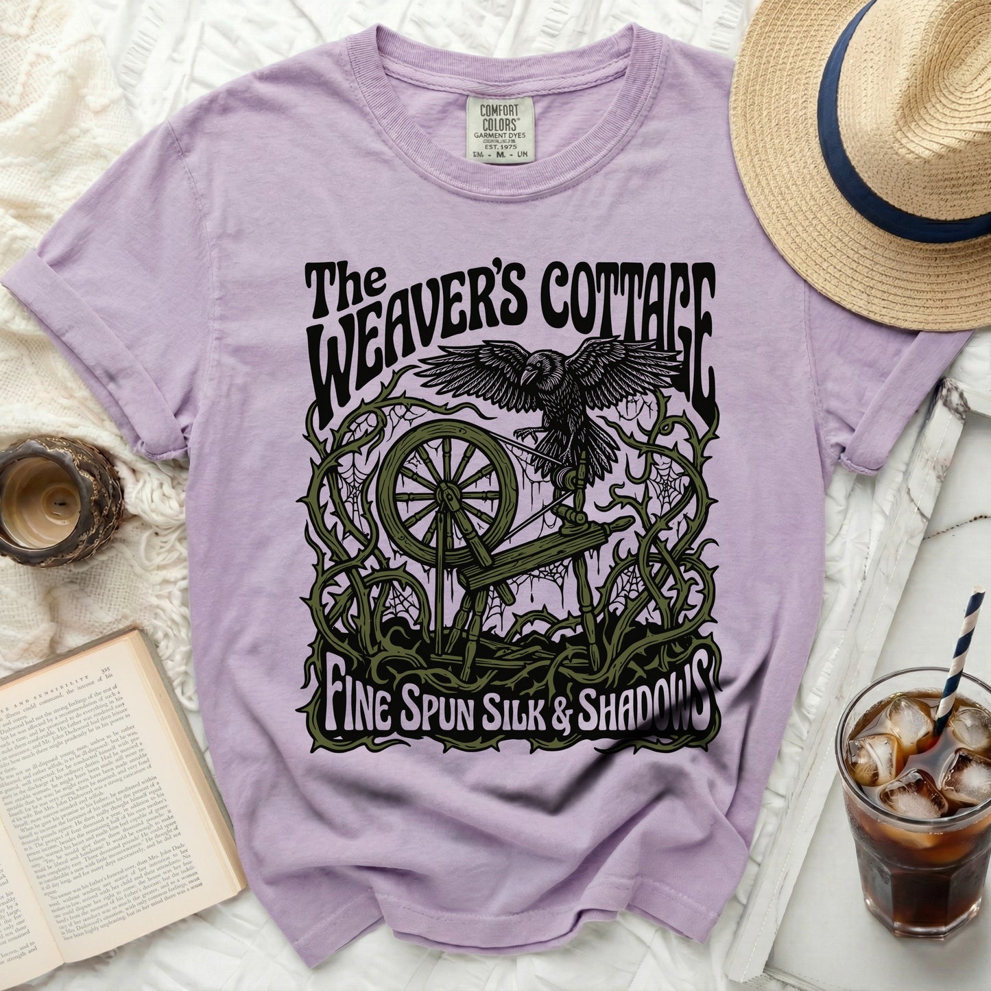 The Weaver's Cottage t-shirt with raven, spinning wheel, and text.