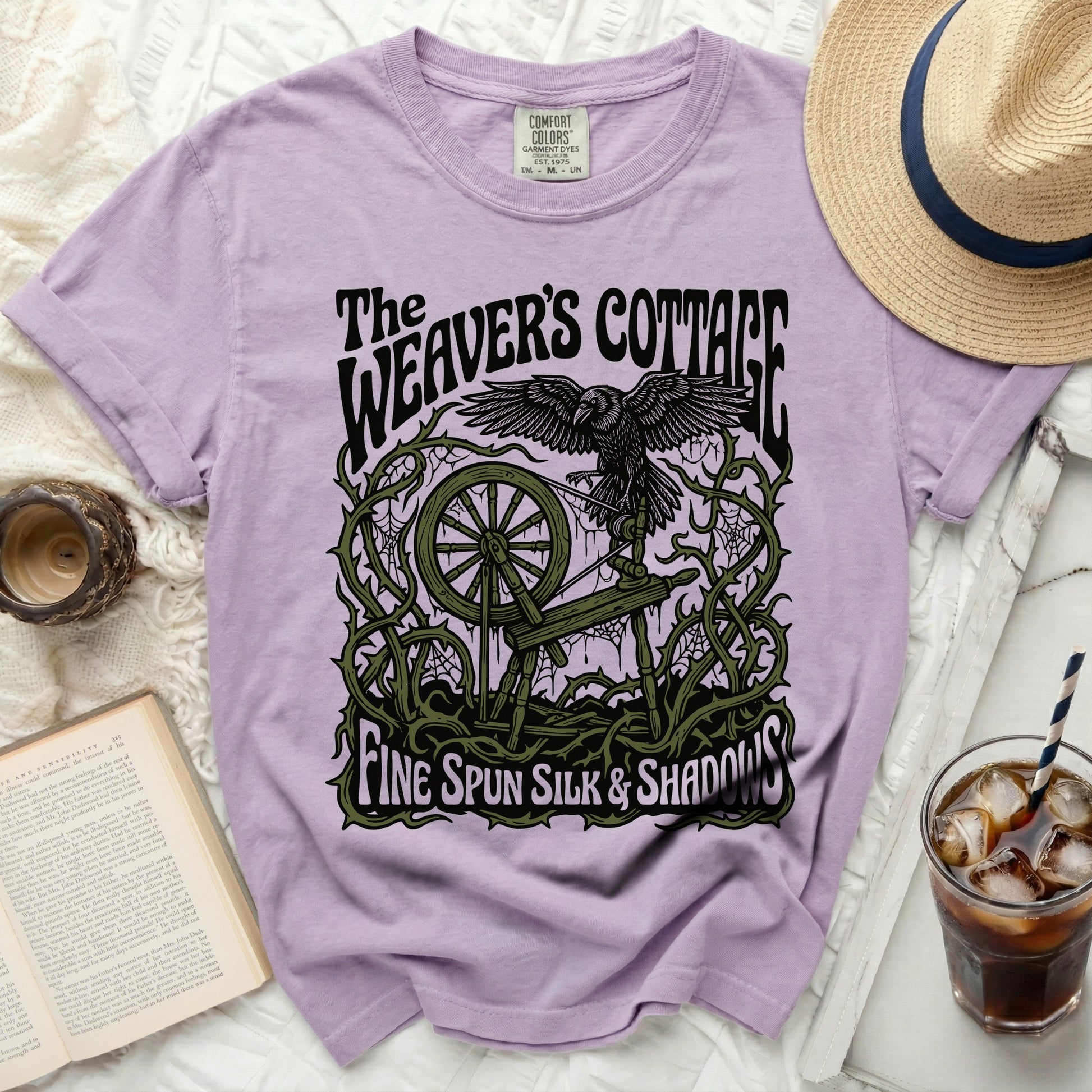 The Weaver's Cottage t-shirt with raven, spinning wheel, and text.