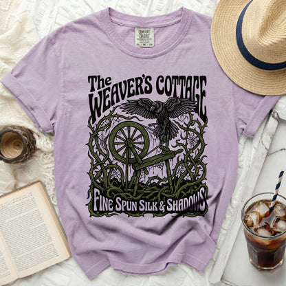 The Weaver's Cottage t-shirt with raven, spinning wheel, and text.