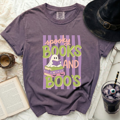 Purple t-shirt with "spooky books and boo's" Halloween graphic.