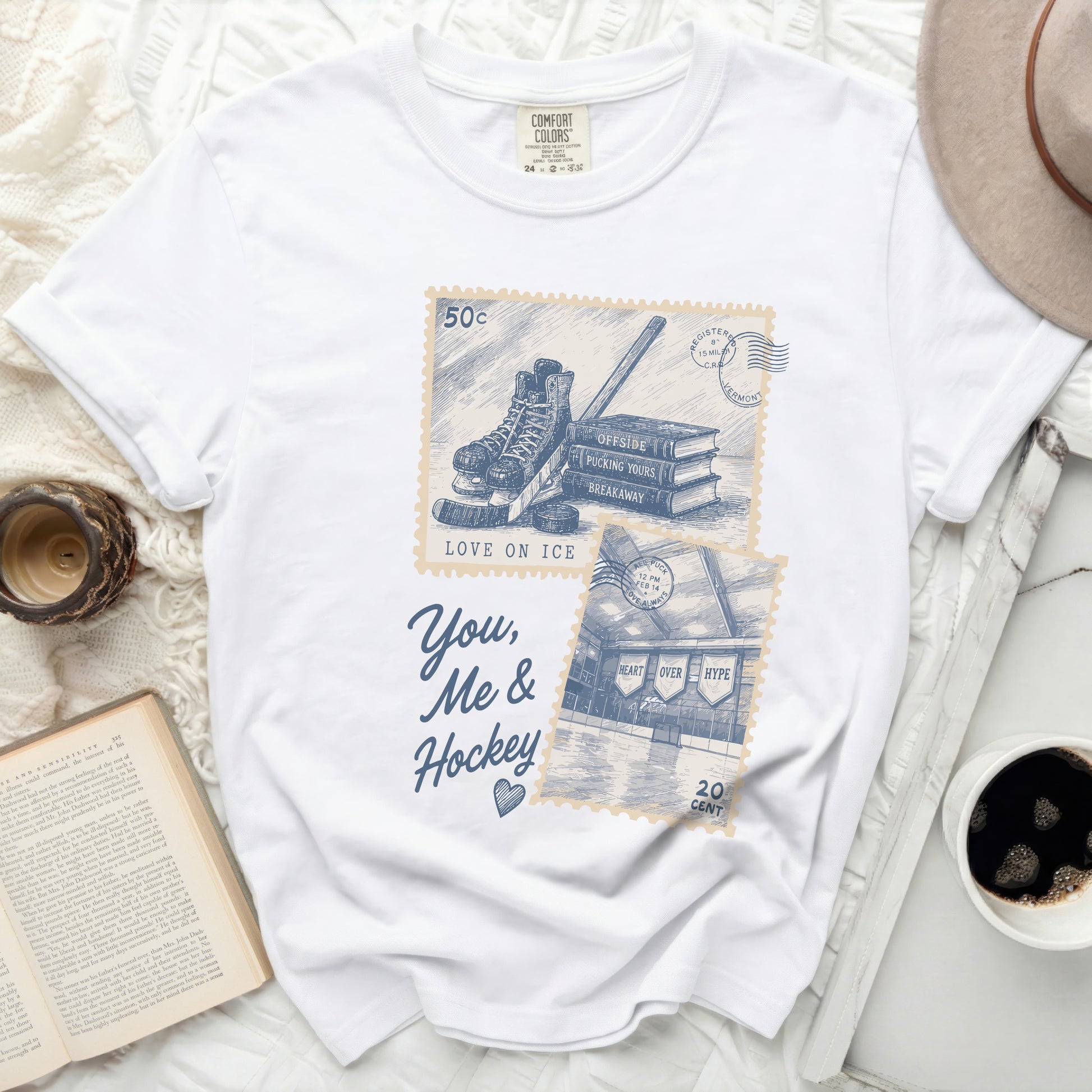 White t-shirt with "You, Me & Hockey" text and ice skate graphic.