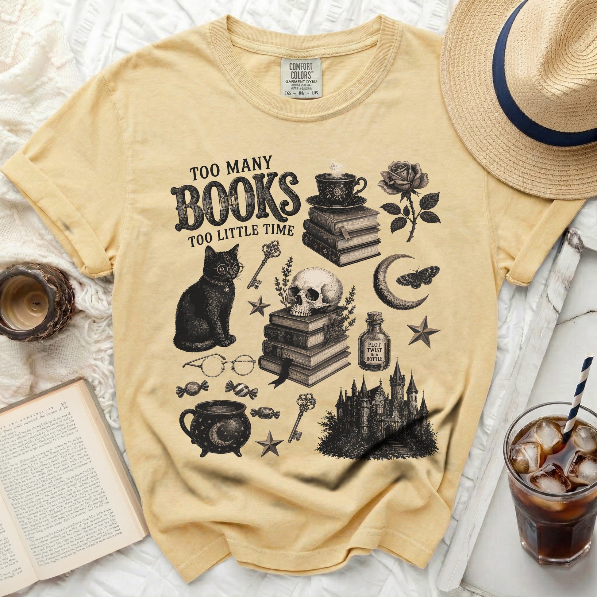 Yellow t-shirt with "Too Many Books Too Little Time" graphic and literary motifs.