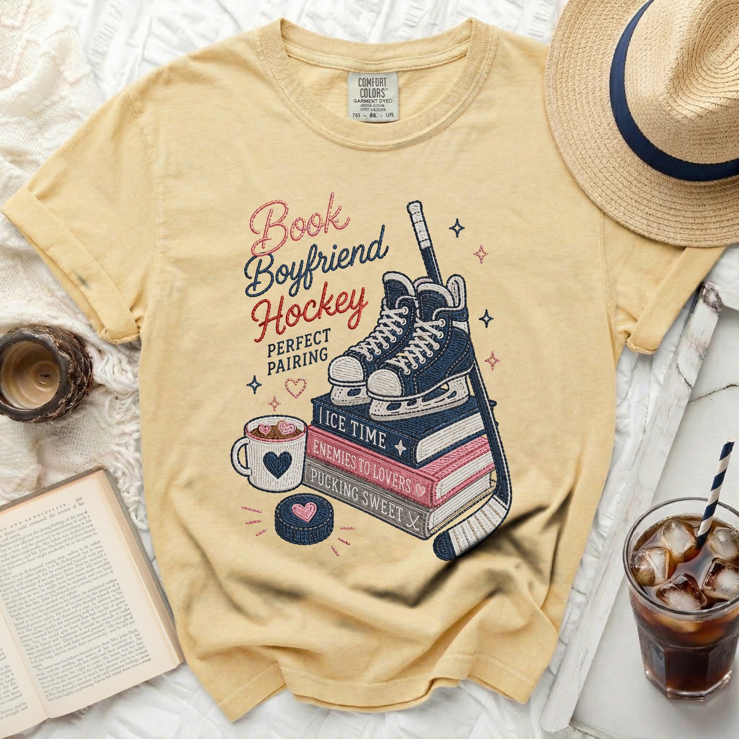 Yellow t-shirt with "Book Boyfriend Hockey Perfect Pairing" text and hockey theme graphics.