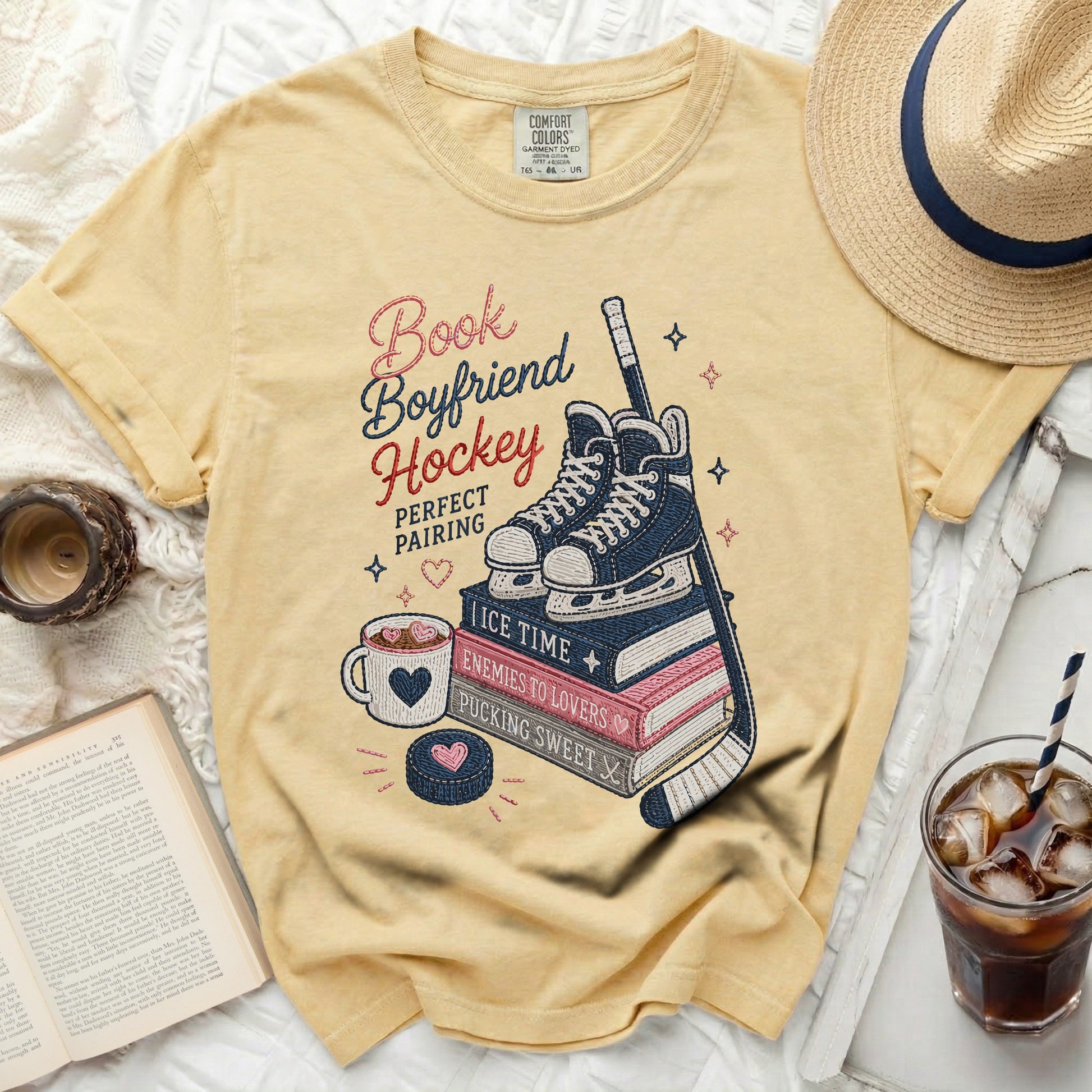 Yellow t-shirt with "Book Boyfriend Hockey Perfect Pairing" text and hockey theme graphics.