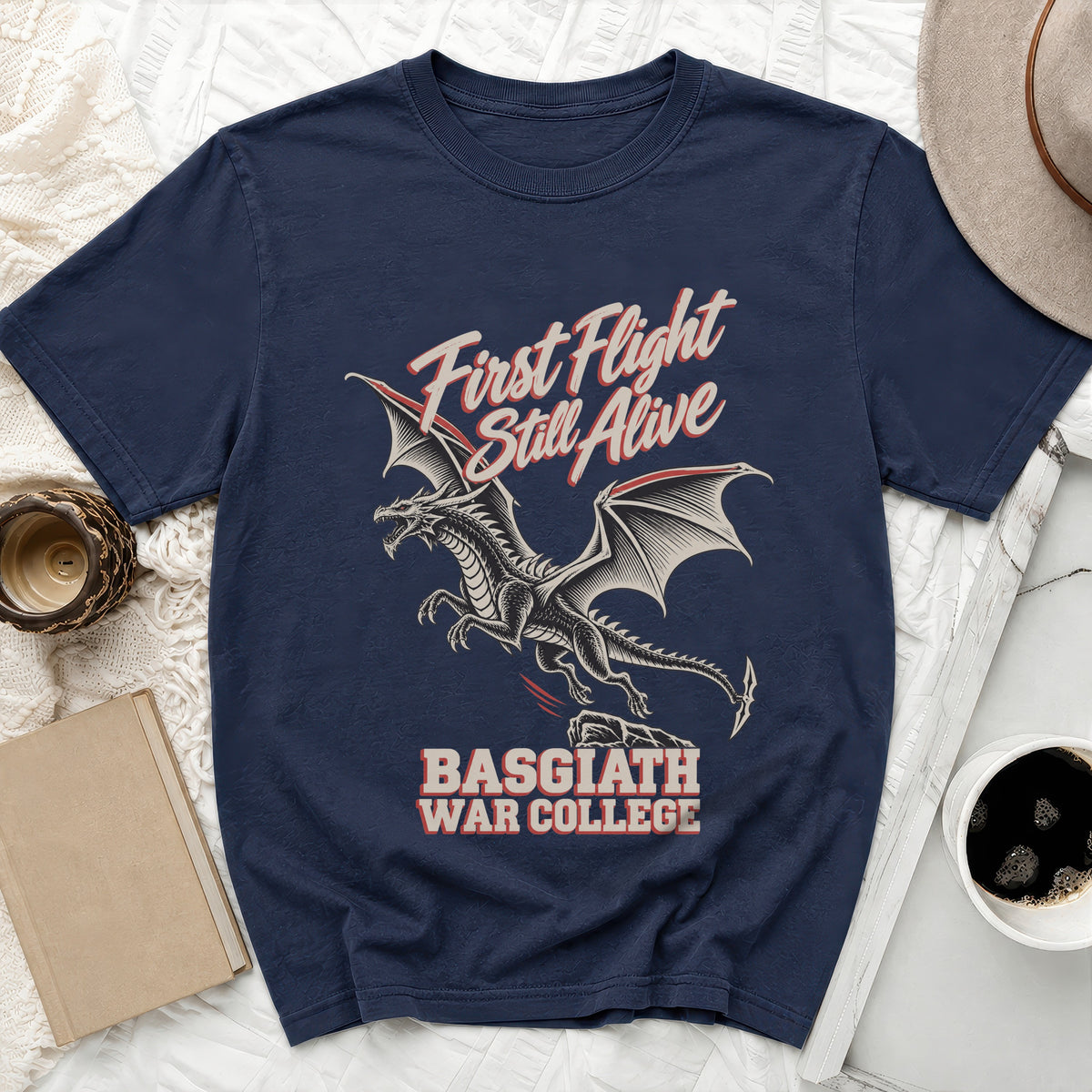 Navy t-shirt with a dragon graphic and text "First Flight Still Alive BASGIATH WAR COLLEGE".