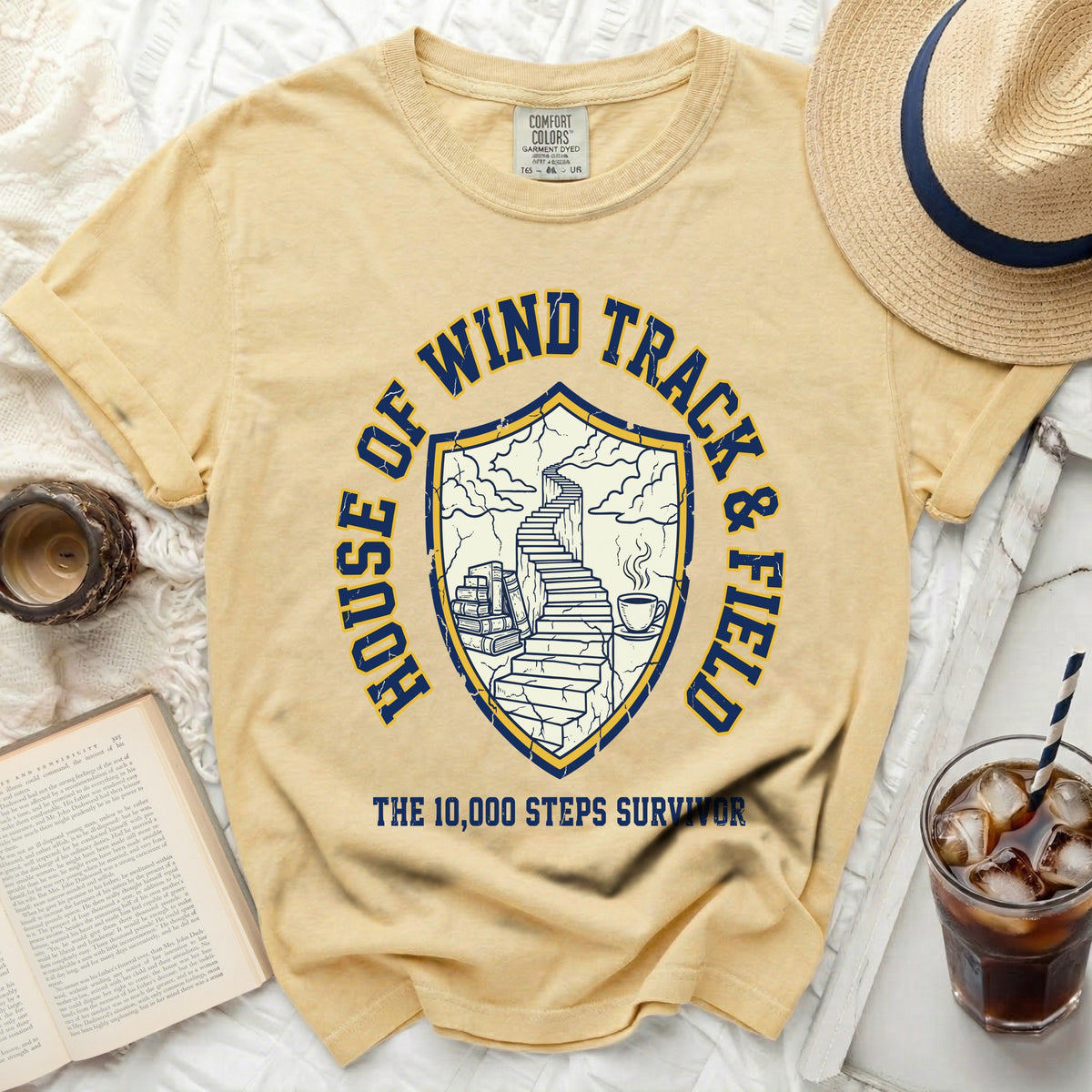 Yellow t-shirt with "House of Wind Track & Field" and "The 10,000 Steps Survivor" graphic.