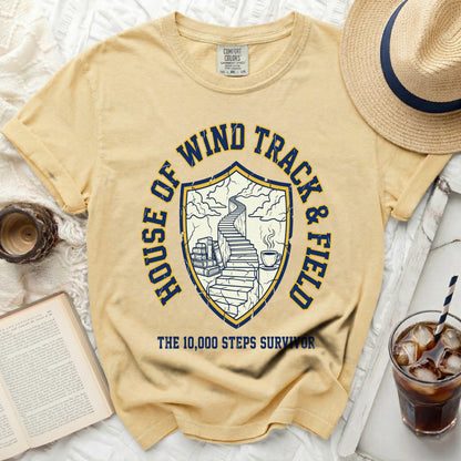 Yellow t-shirt with "House of Wind Track & Field" and "The 10,000 Steps Survivor" graphic.