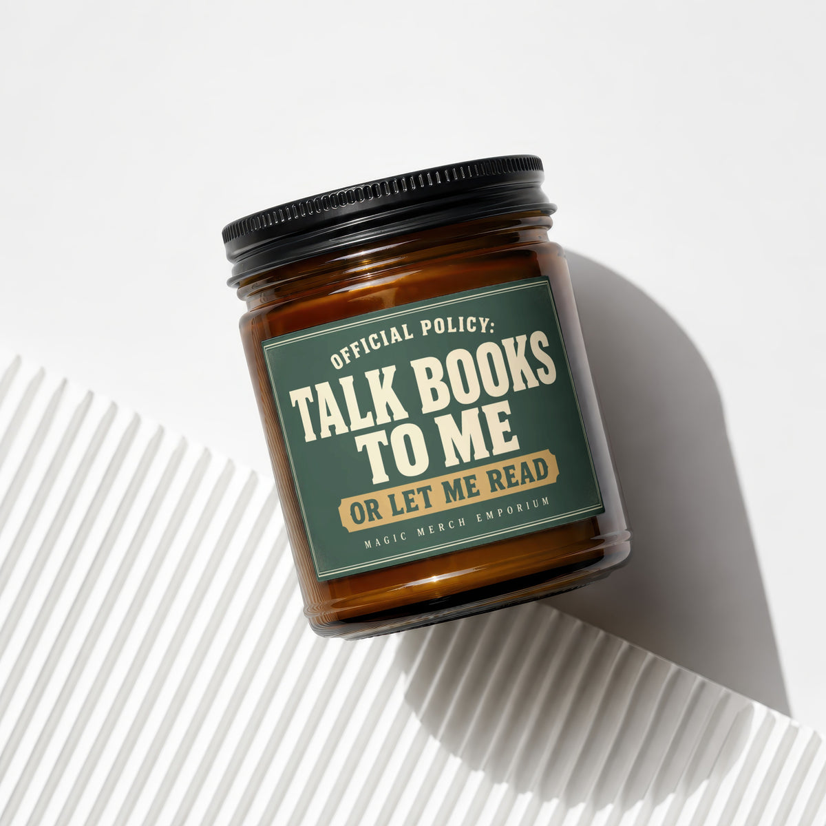 Amber jar candle with "Talk Books To Me Or Let Me Read" text.