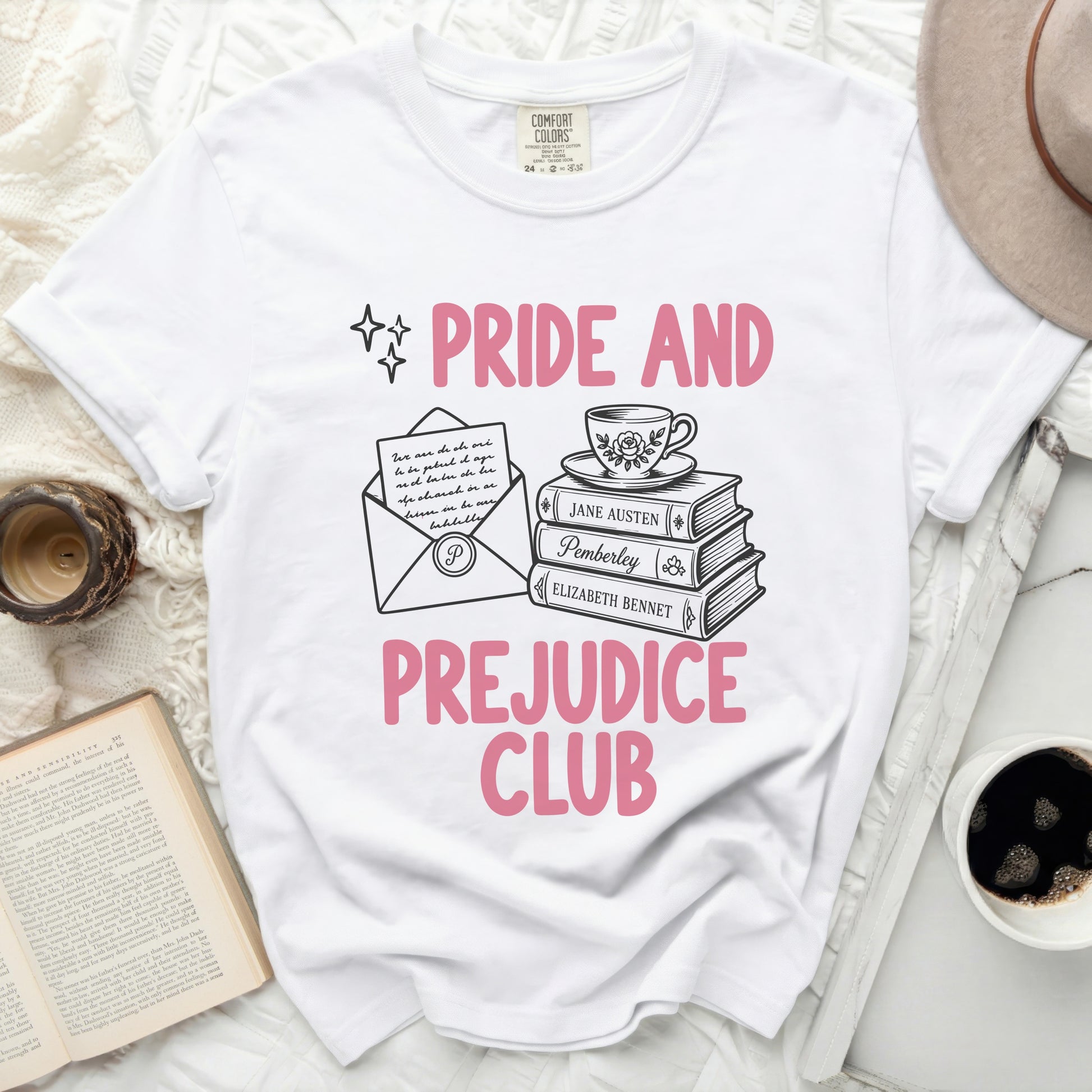White t-shirt with "Pride and Prejudice Club" text and illustrations.