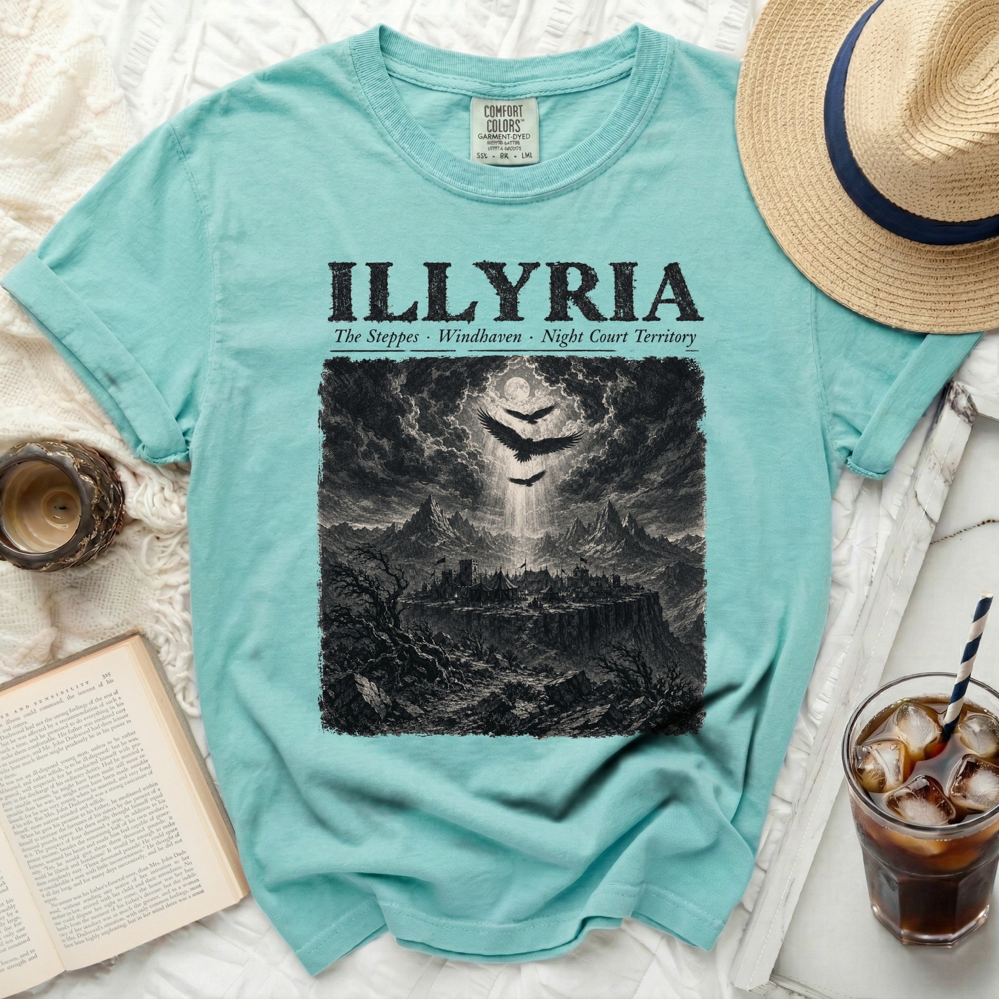 Teal t-shirt with "ILLYRIA The Steppes Windhaven Night Court Territory" graphic.