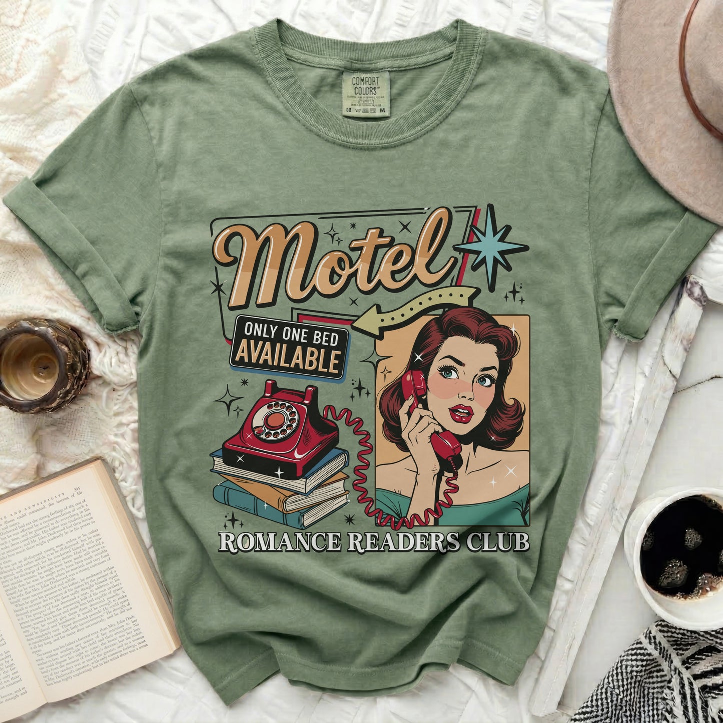 Olive green t-shirt with "Motel Only One Bed Available Romance Readers Club" graphic.