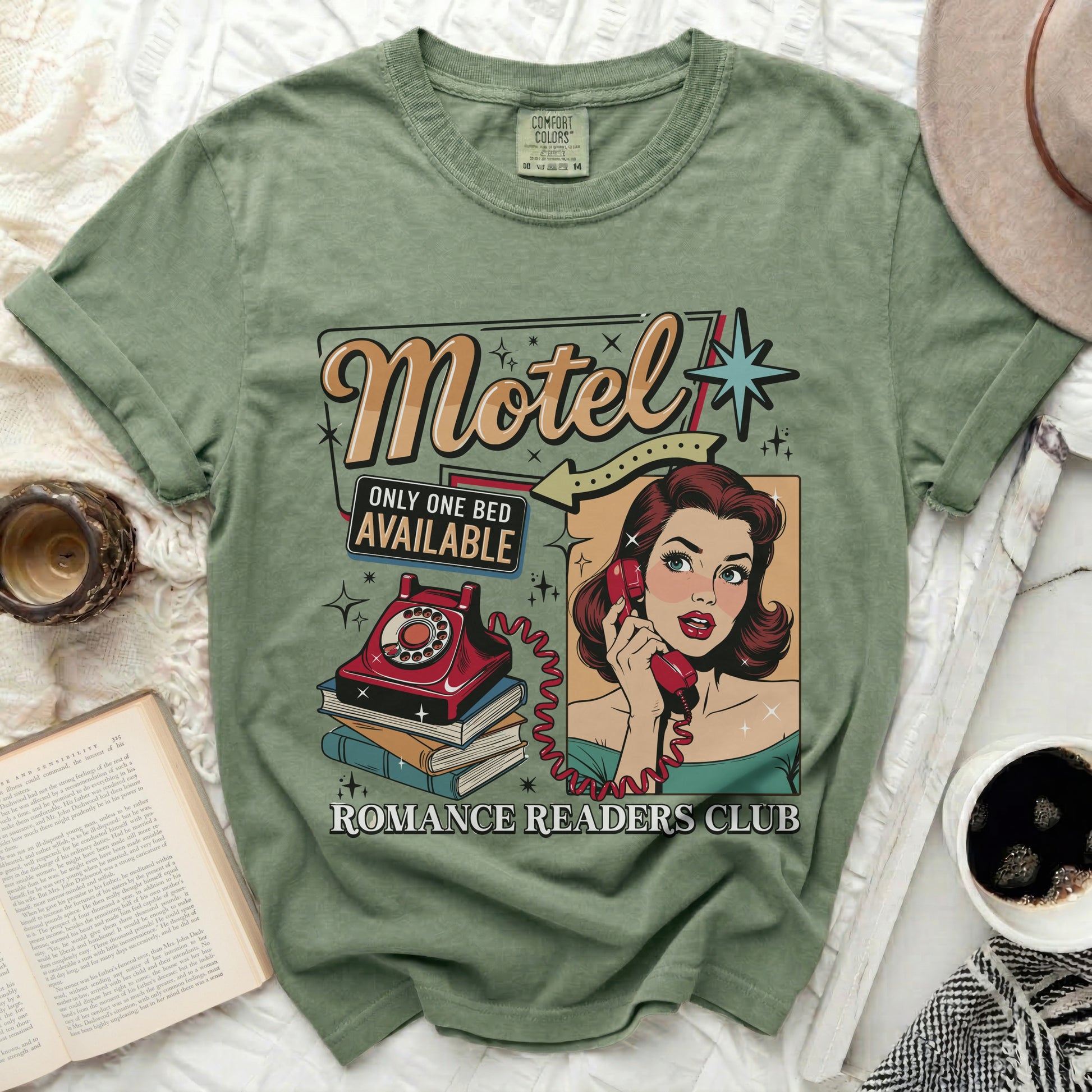 Olive green t-shirt with "Motel Only One Bed Available Romance Readers Club" graphic.