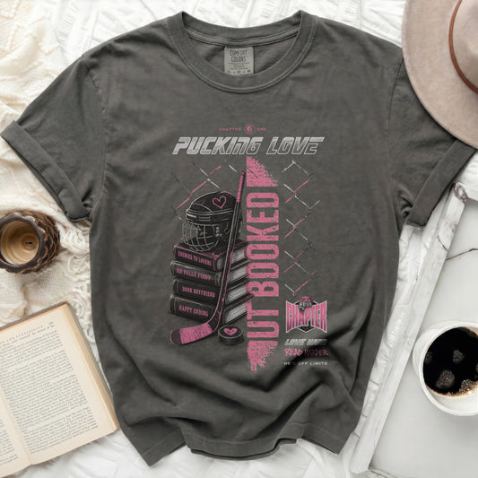 Dark grey t-shirt with "Pucking Love" text and hockey graphics.