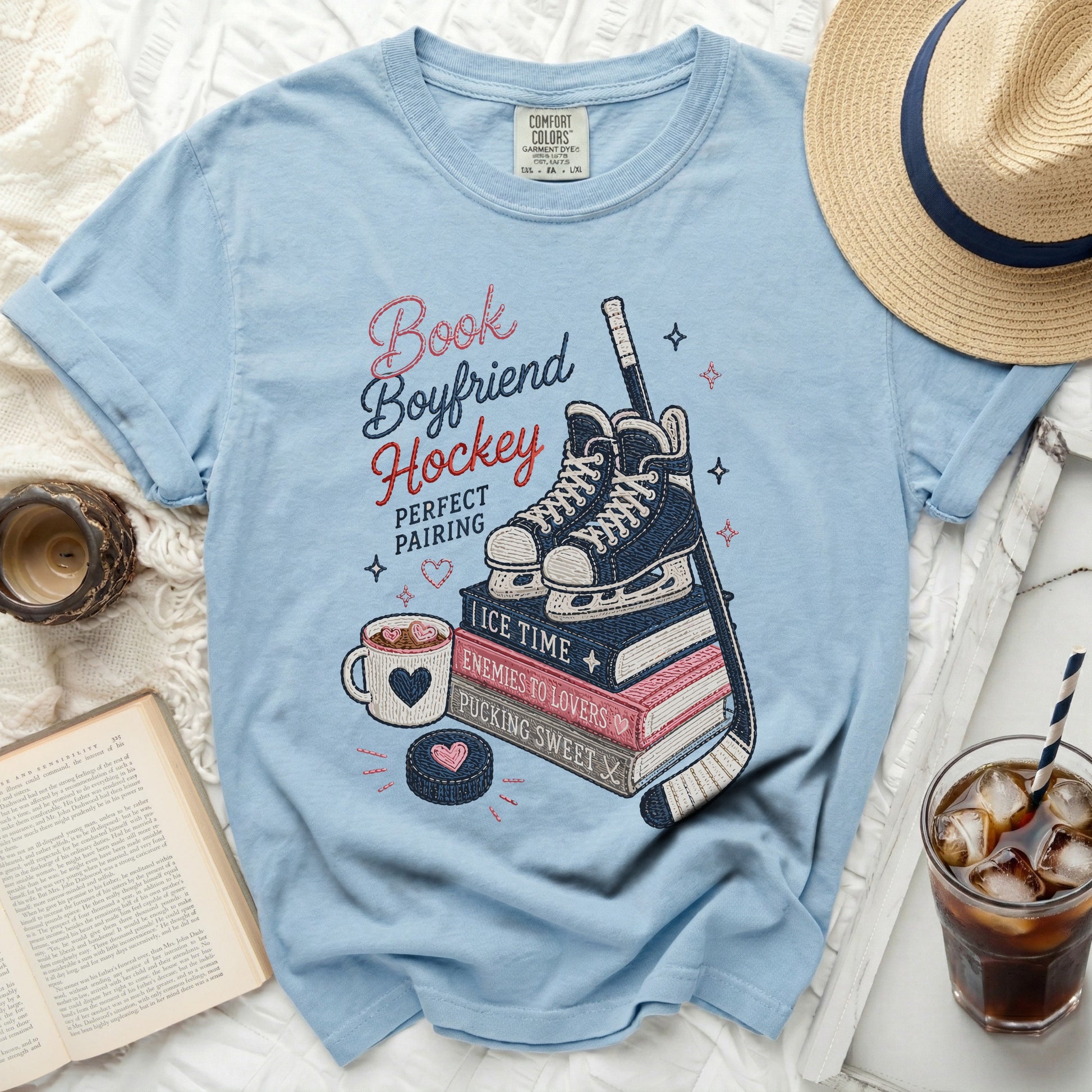Light blue t-shirt with "Book Boyfriend Hockey Perfect Pairing" text and hockey graphics.