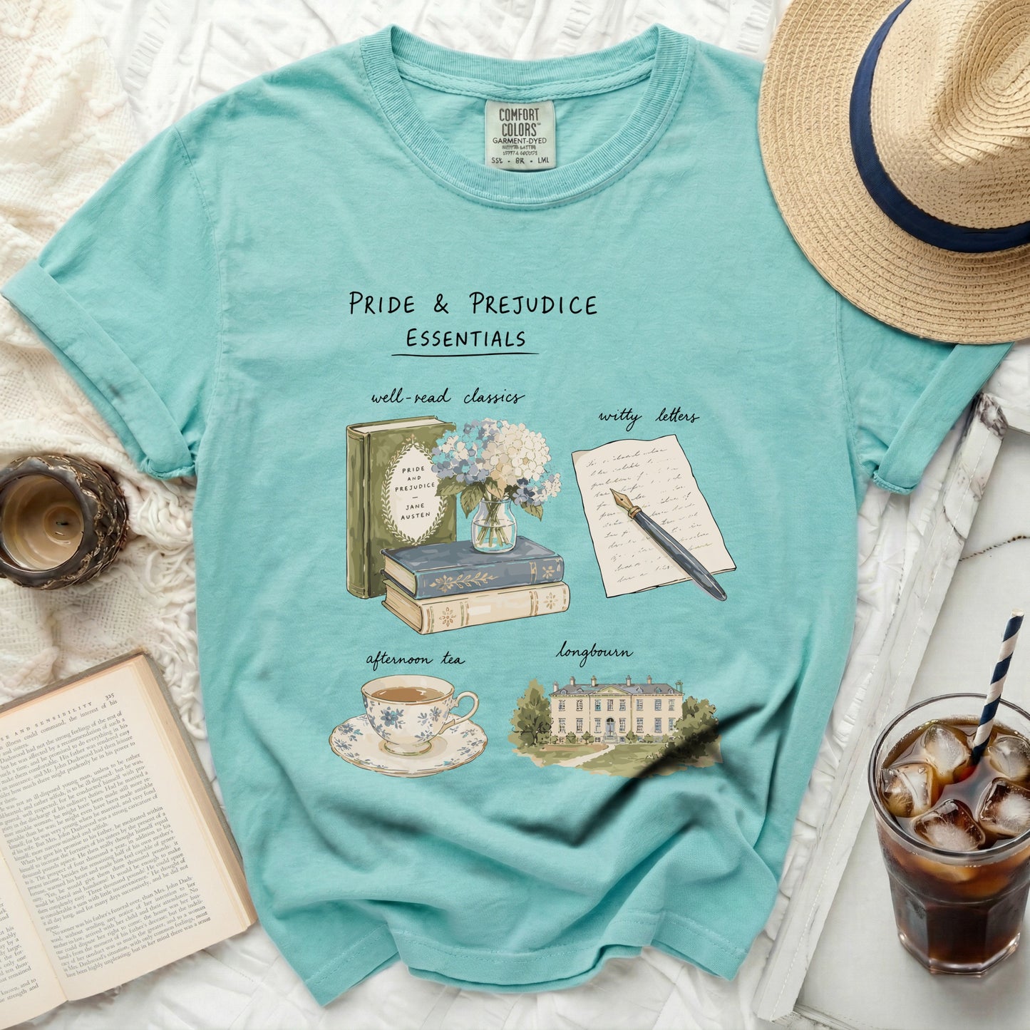 Pride & Prejudice Essentials t-shirt with illustrations of books, tea, letters and Longbourn house.