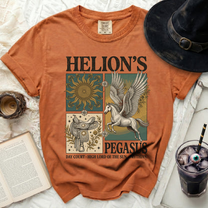Orange t-shirt with "Helion's Pegasus" graphic, sun, saddle, and winged horse.