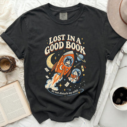Black t-shirt with "Lost in a Good Book" text and a cat in space reading.