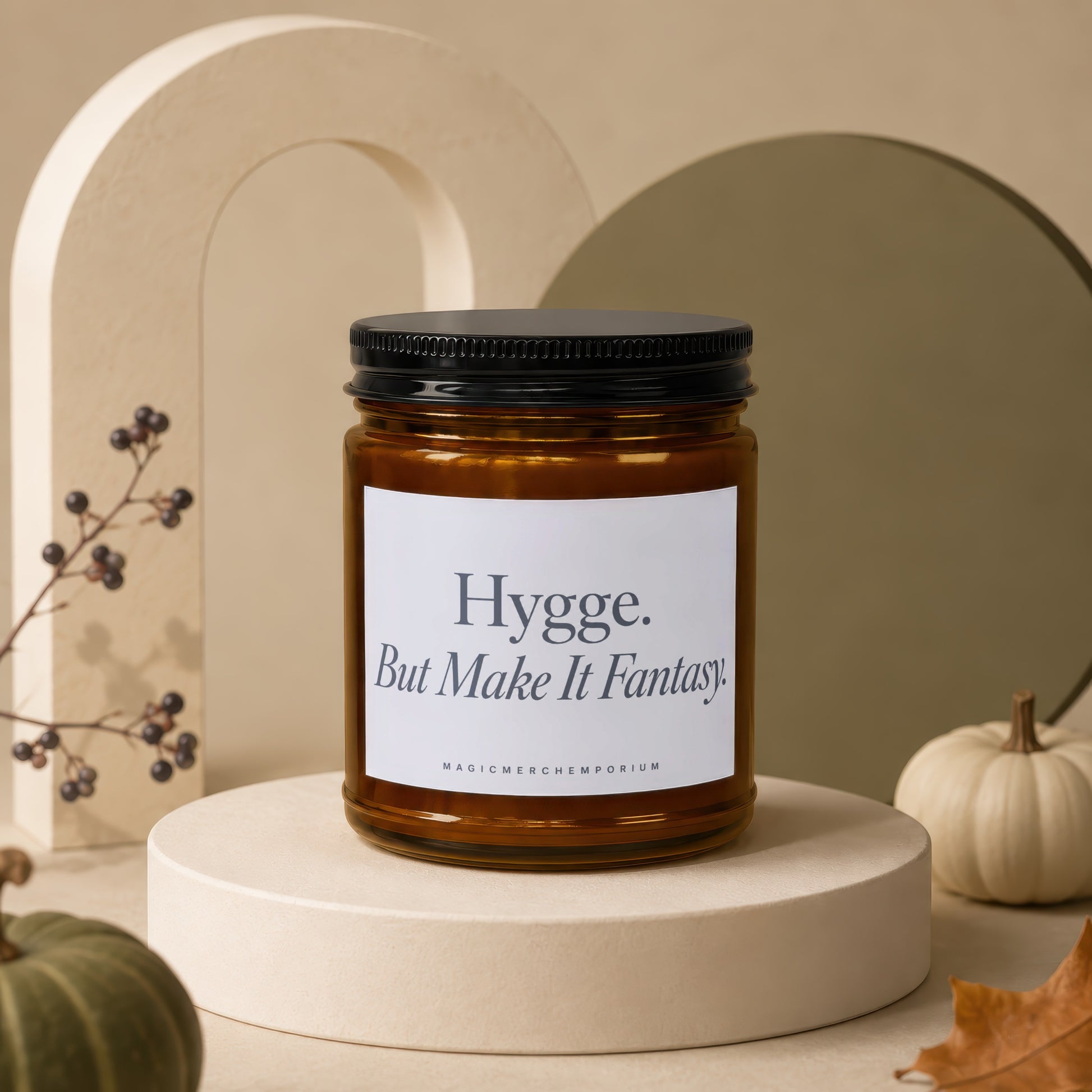 Amber jar candle with black lid, label reads "Hygge. But Make It Fantasy."