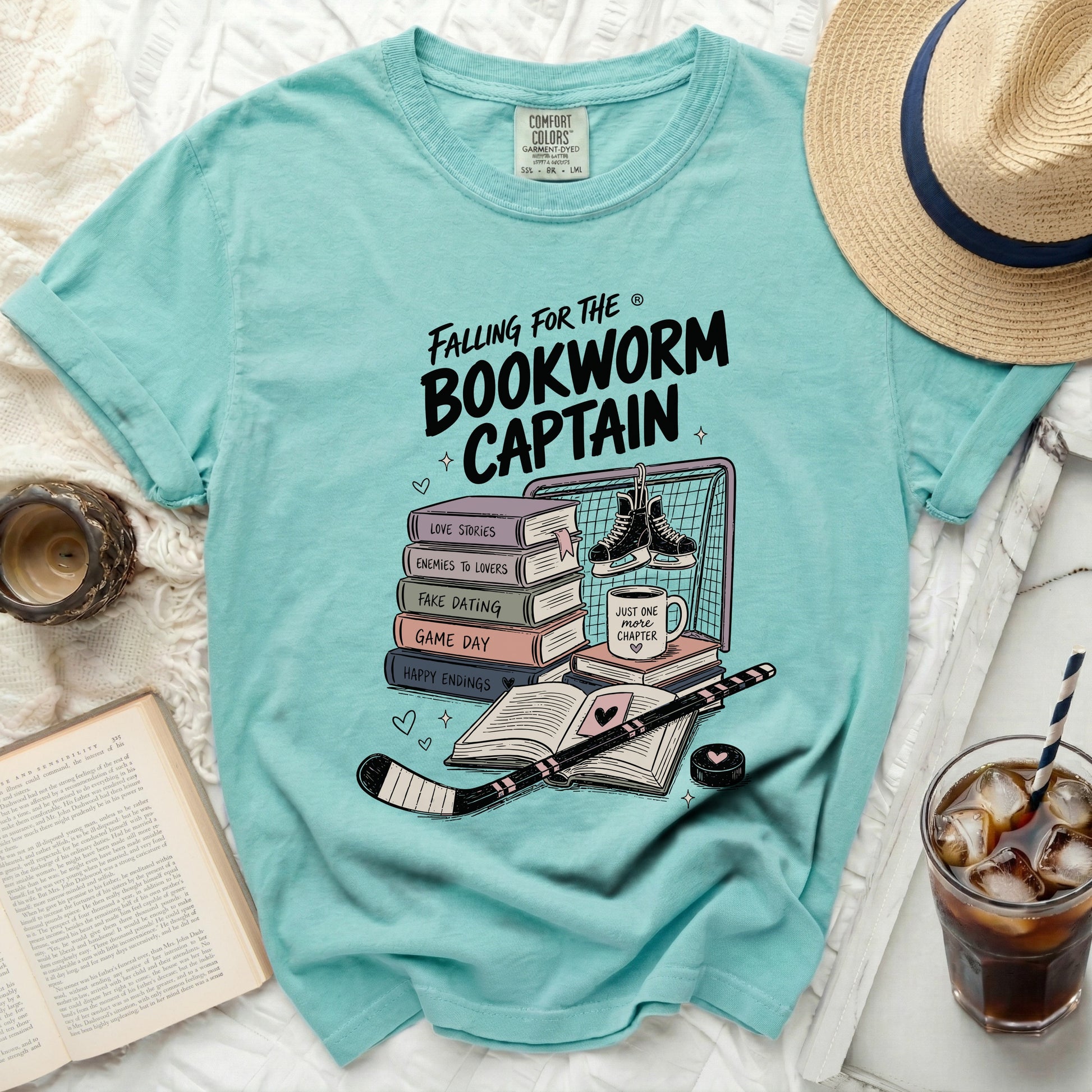 Aqua t-shirt with "Falling for the Bookworm Captain" and book-themed hockey graphics.