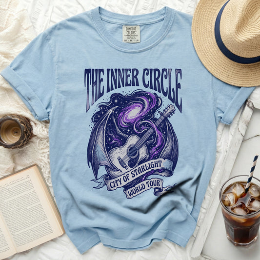 Light blue t-shirt with "The Inner Circle City of Starlight World Tour" graphic.