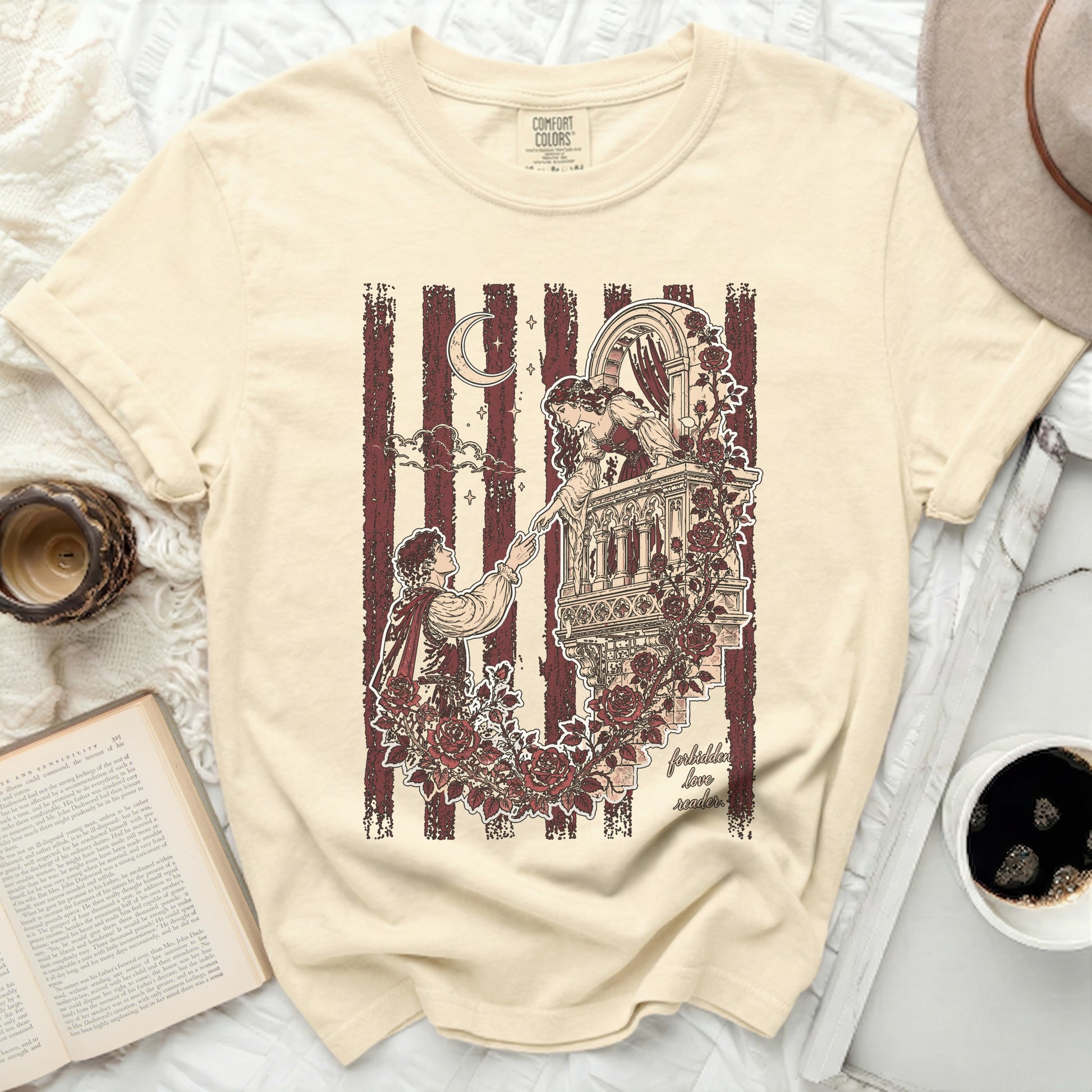 Cream t-shirt with "forbidden love" literary scene illustration and "Comfort Colors" logo.