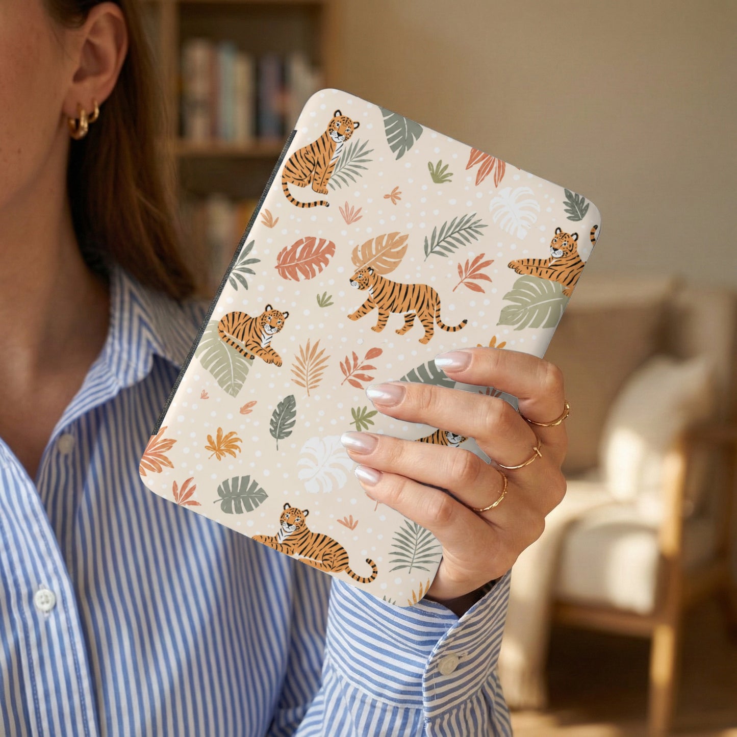 Tan case with repeating pattern of cartoon tigers and tropical leaves