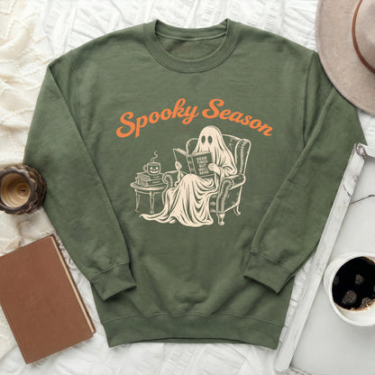 Green sweatshirt with ghost reading titled "Dead Tired But Well Read."