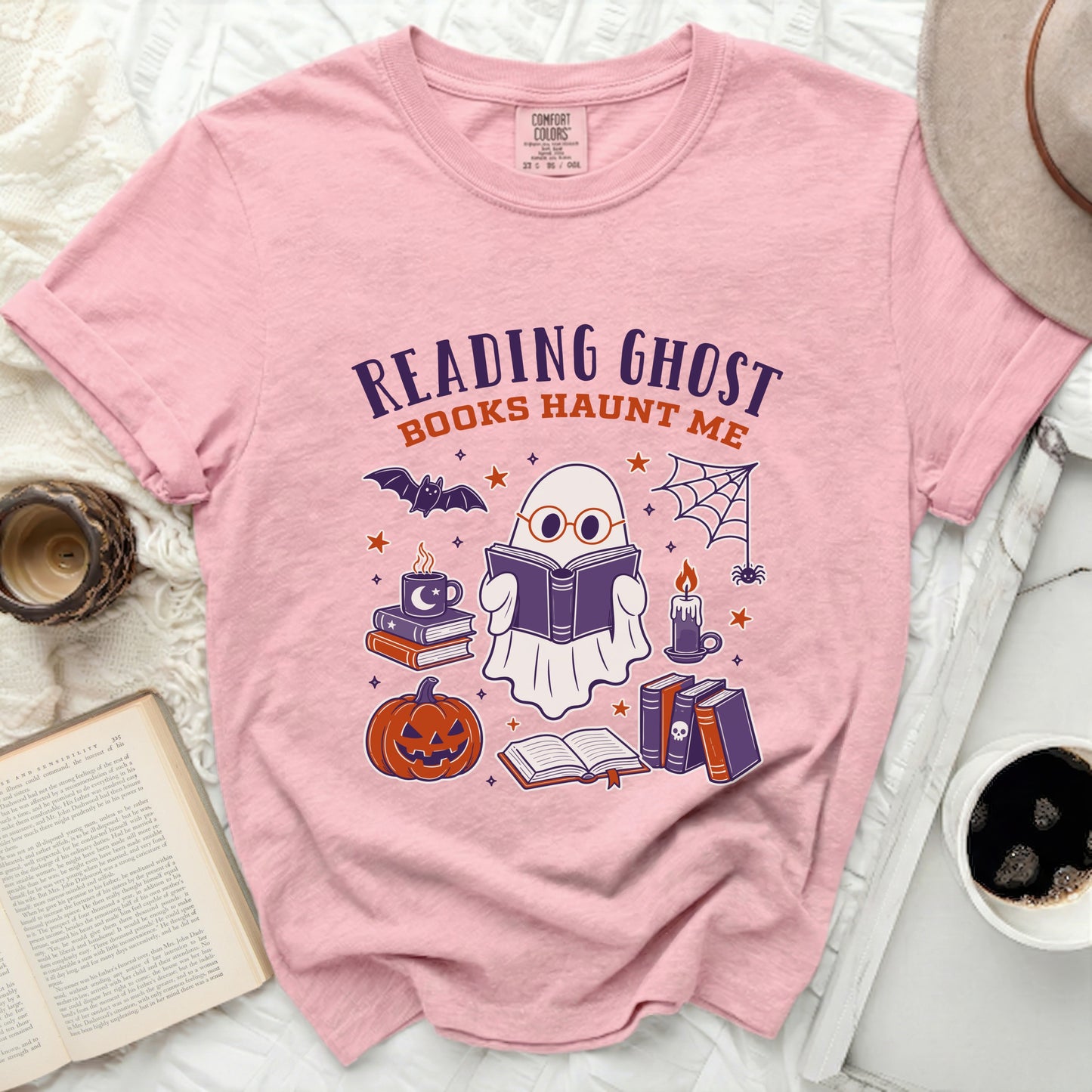Pink t-shirt with "Reading Ghost Books Haunt Me" graphic and Halloween icons.