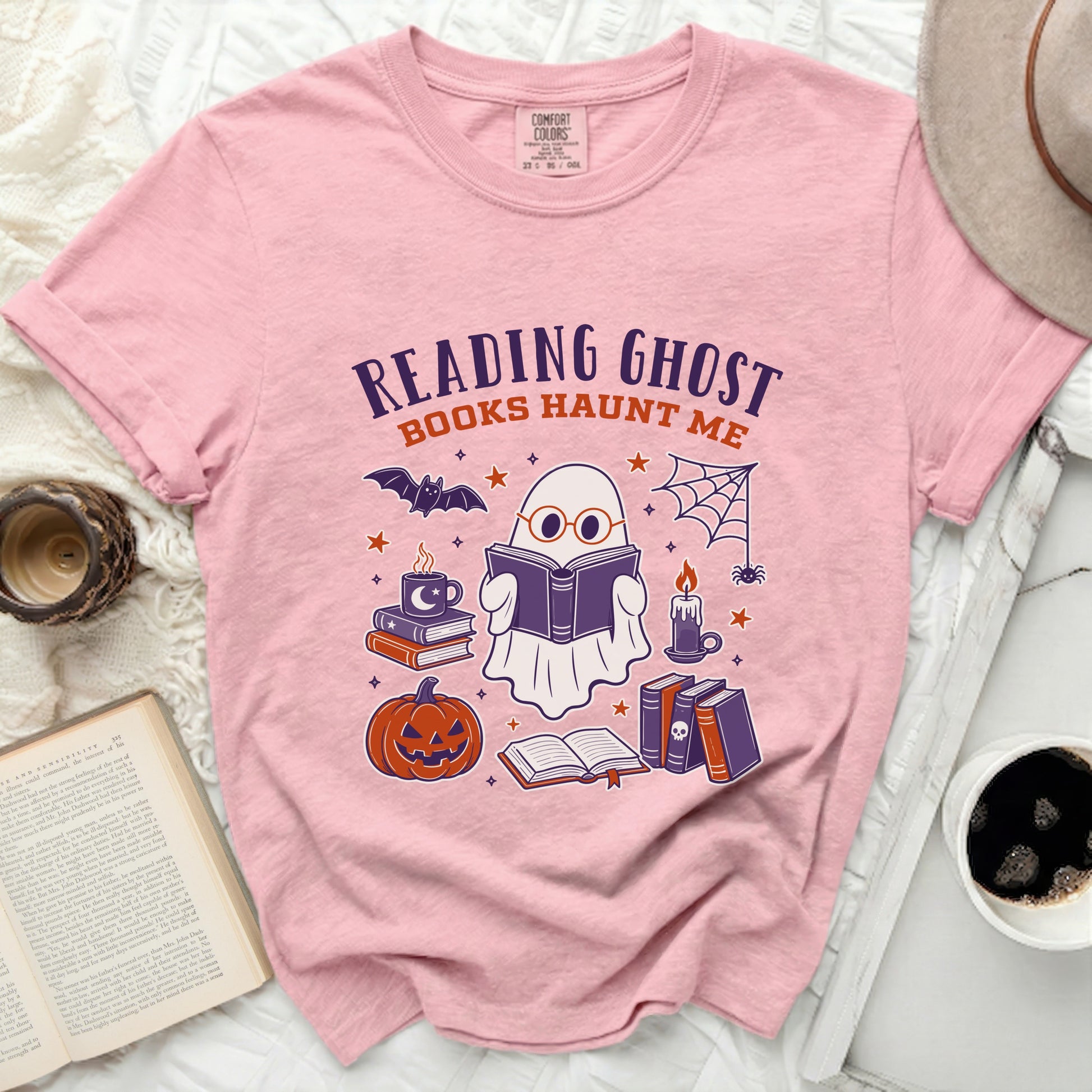 Pink t-shirt with "Reading Ghost Books Haunt Me" graphic and Halloween icons.