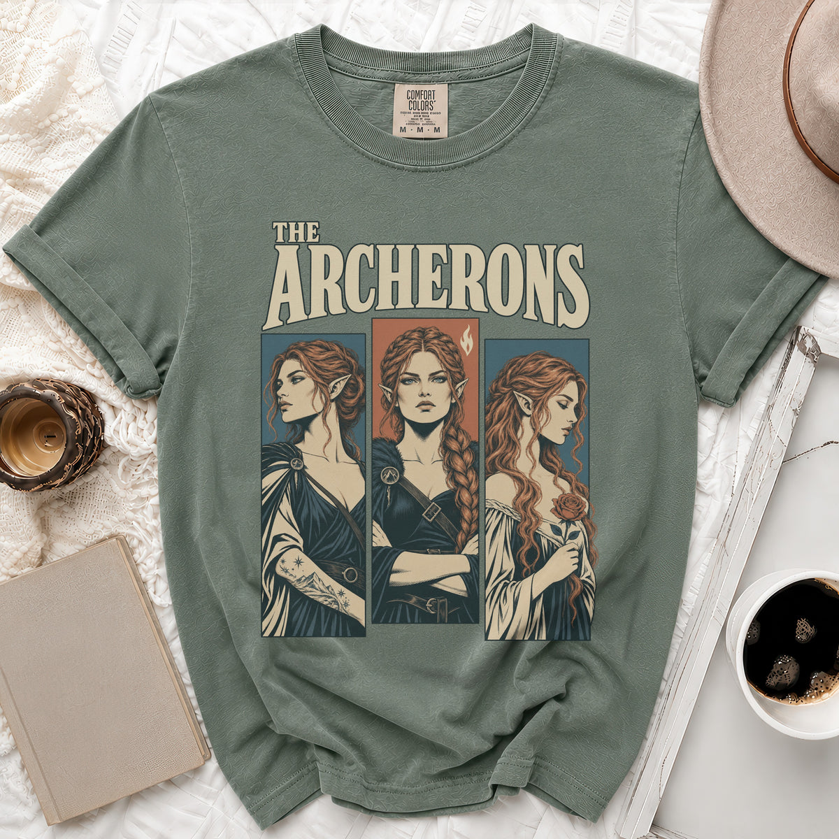 Green t-shirt with "The Archerons" text and three illustrated women.