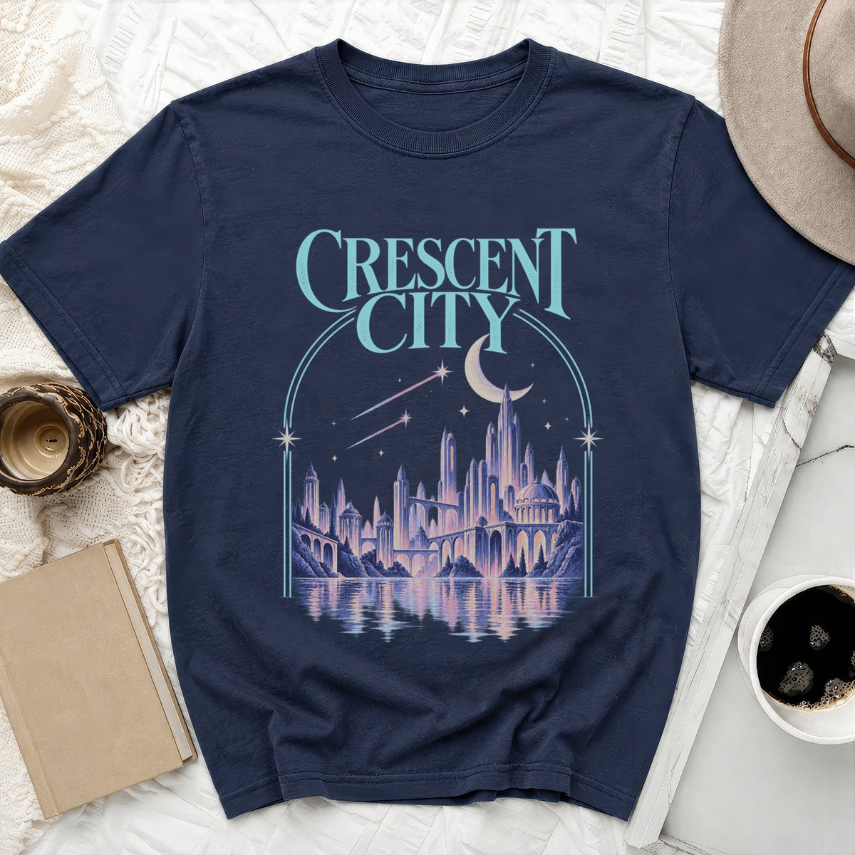 Navy t-shirt with "CRESCENT CITY" and fantasy cityscape art.