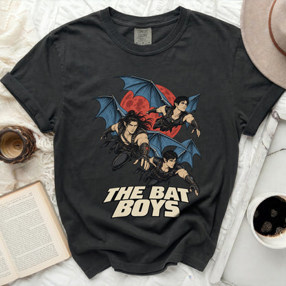 Dark t-shirt with a graphic of three winged characters and "The Bat Boys" text.