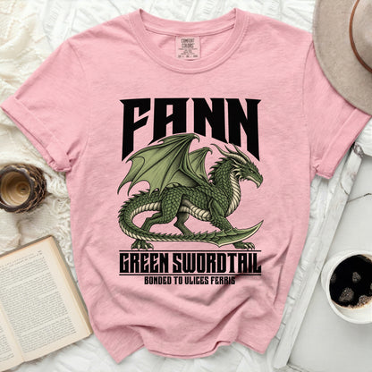 Pink t-shirt with a green dragon graphic and text: Fann, Green Swordtail, Bonded to Ulises Ferris.