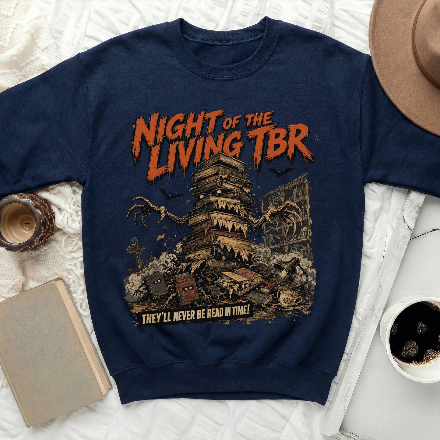 Navy sweatshirt with "Night of the Living TBR" text and monster books graphic.