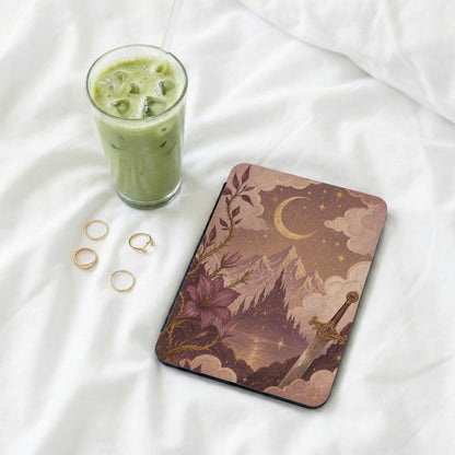 E-reader with fantasy castle, sword, moon, and stars design.
