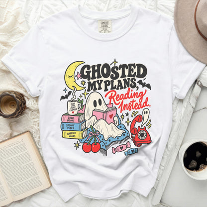 White t-shirt with "Ghosted My Plans, Reading Instead" graphic.
