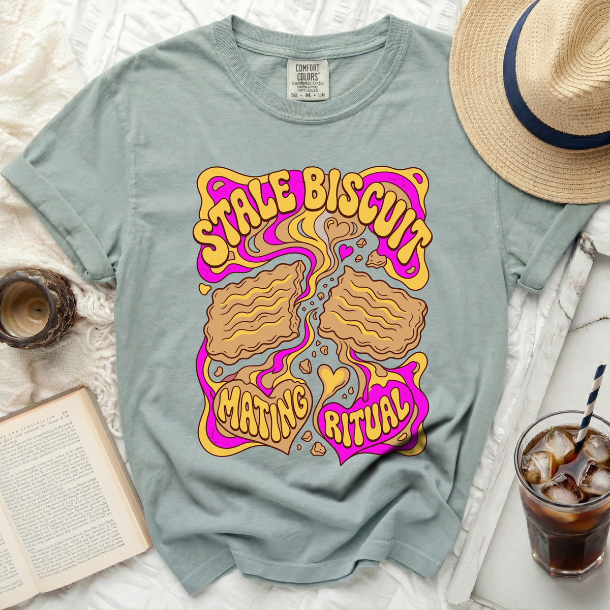 T-shirt with "Stale Biscuit Mating Ritual" text in a psychedelic font.