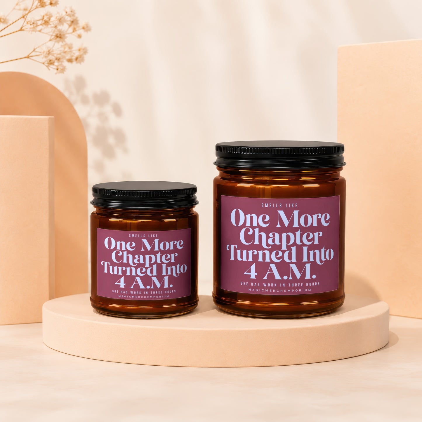 Two amber jar candles displaying "One More Chapter Turned Into 4 A.M." text.