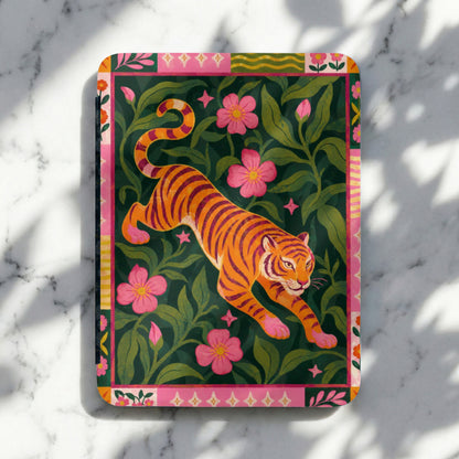 Orange tiger with pink flowers and green leaves on a decorative card.