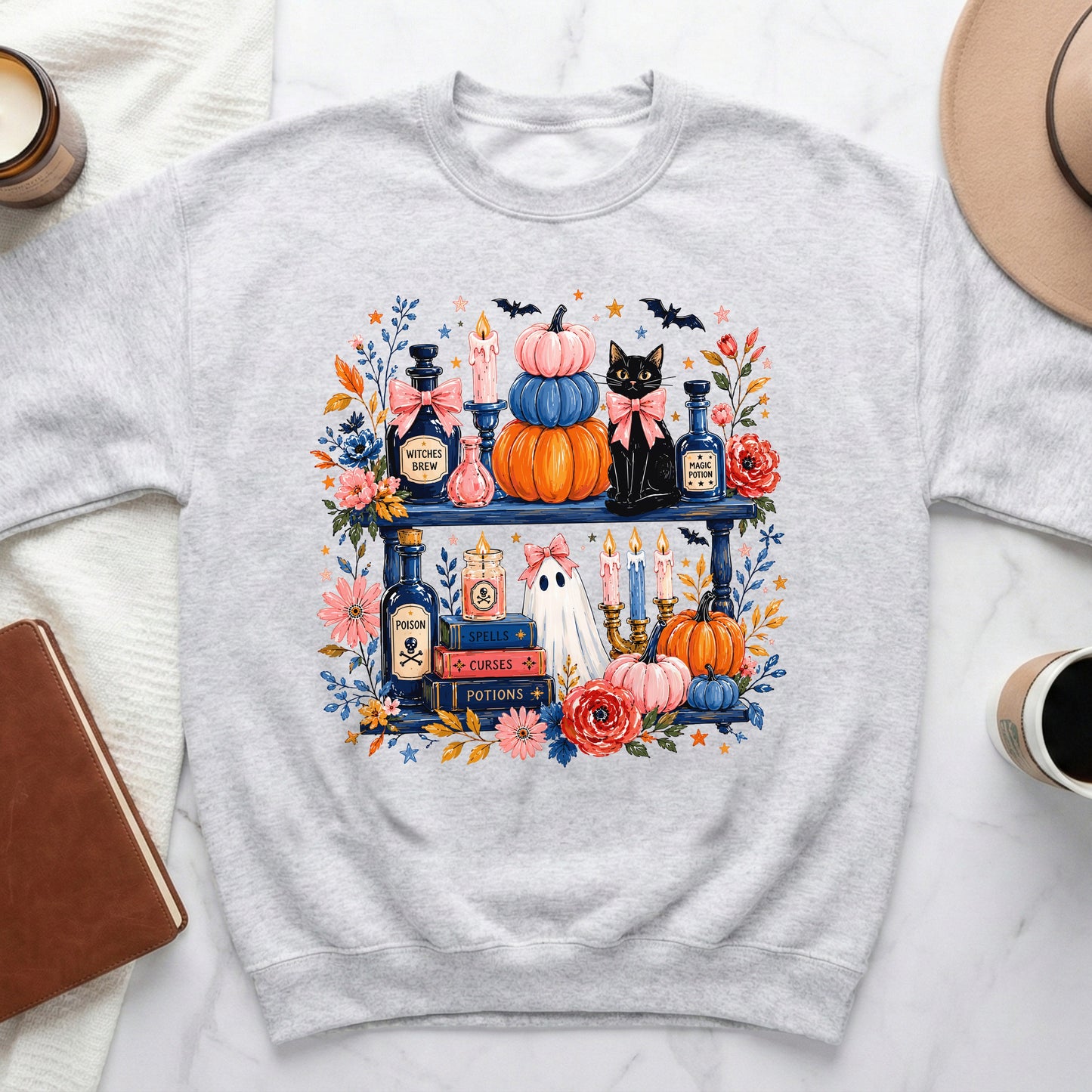 Crewneck sweatshirt with a Halloween graphic featuring a black cat and witchy items.
