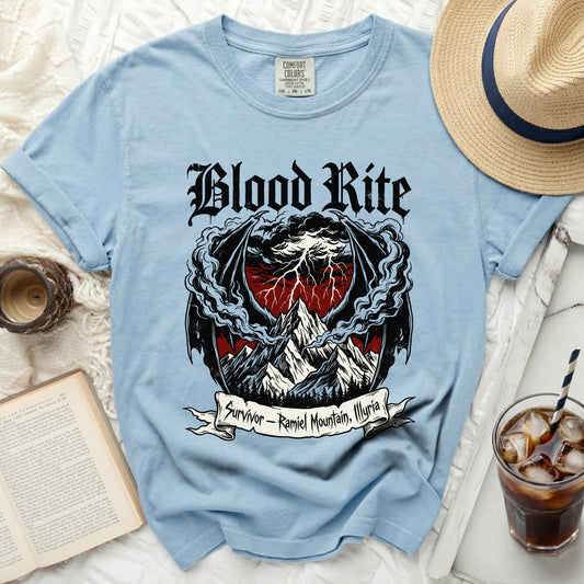 Light blue t-shirt with "Blood Rite" and dragon wings over mountains and lightning.